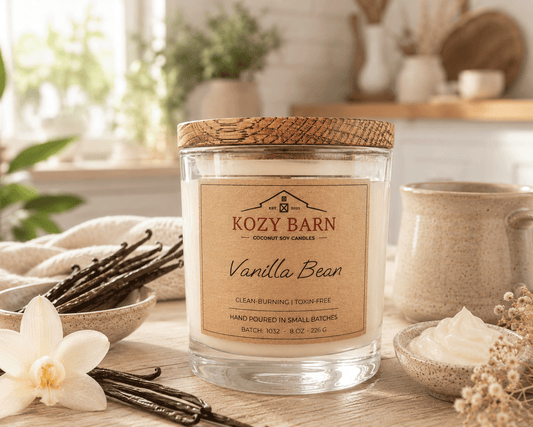 Kozy Barn candle labeled Vanilla Bean sitting on kitchen island with vanilla bean and bowel of whipped cream.